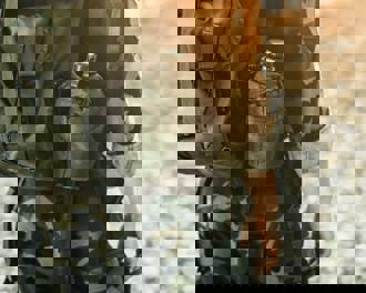 Soldier in military kit performing tasks