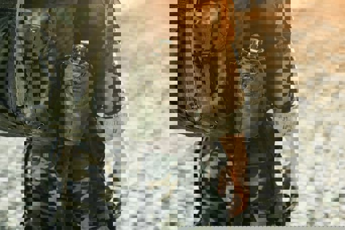 Soldier in military kit performing tasks