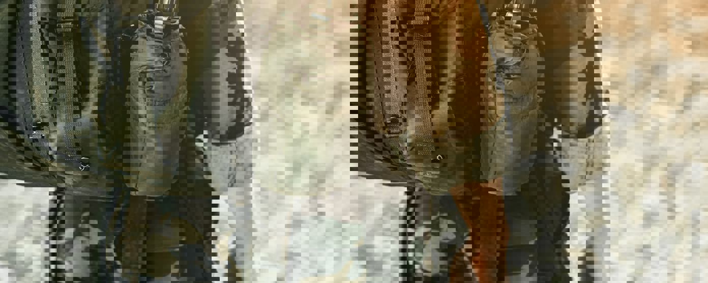 Soldier in military kit performing tasks