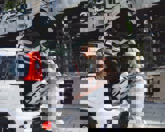 Loading suitcase into car 