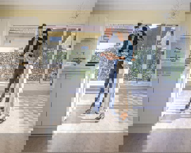 Real estate agent showing house