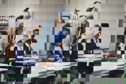 Teacher helping student