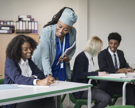 Teacher helping student