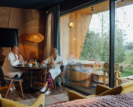 Couple relaxing luxury log cabin