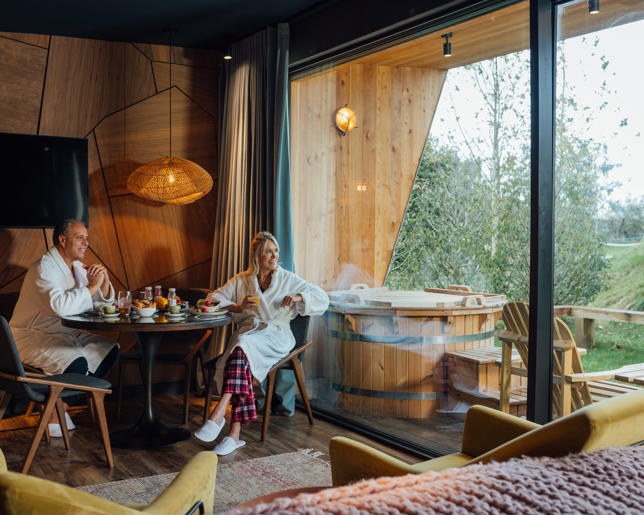 Couple relaxing luxury log cabin