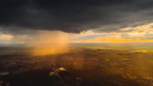 storm clouds over a suburban and countryside landscape