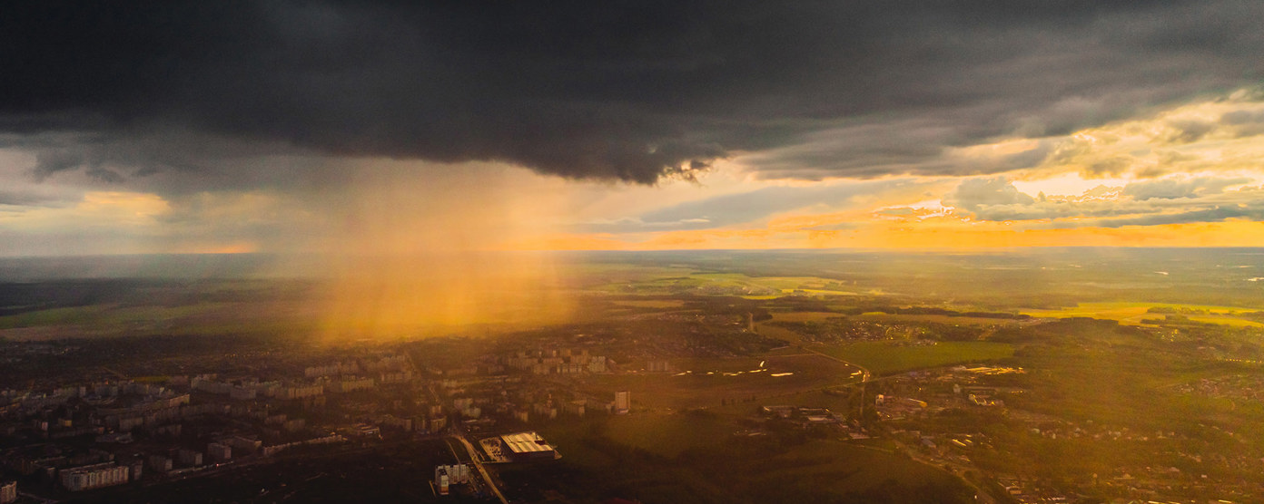 storm clouds over a suburban and countryside landscape