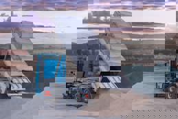 Dump truck unloading gravel at ,quarry