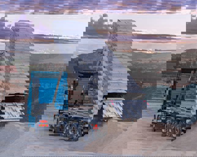 Dump truck unloading gravel at ,quarry