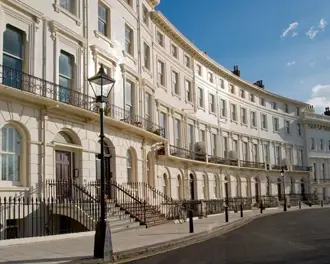 Elegant Regency-style terraced houses with balconies, tall sash windows