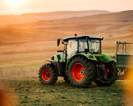 Tractor and trailer transporting harvest