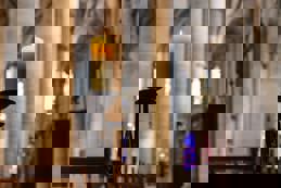 Candlelight in church nave altar in historical city