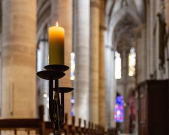 Candlelight in church nave altar in historical city