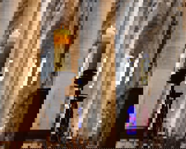 Candlelight in church nave altar in historical city