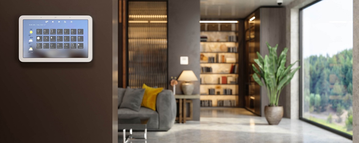 A home security system on the wall of an open plan living room