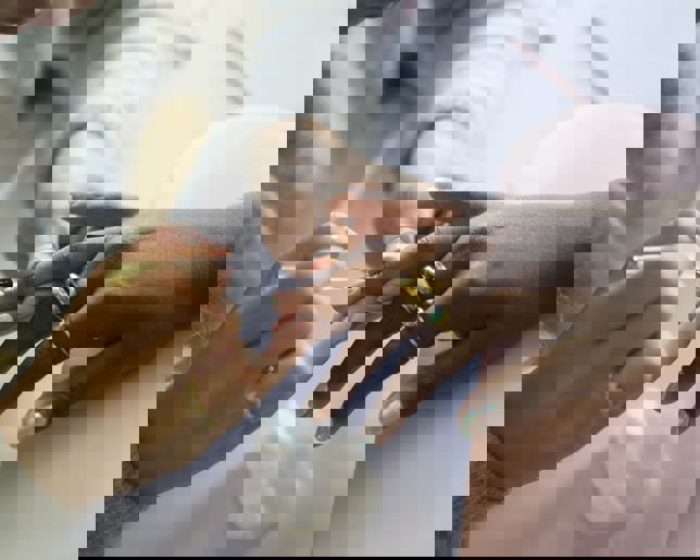 Nail technician applying nail polish