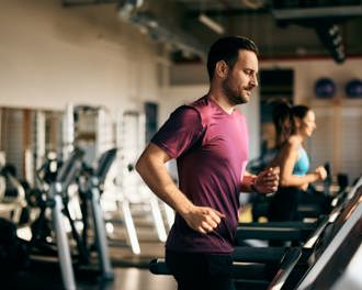 Running on a treadmill at the gym