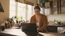 Woman working from home with coffee