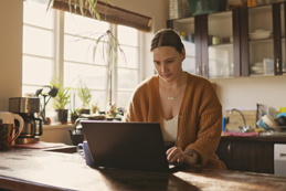Woman working from home with coffee