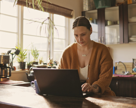 Woman working from home with coffee
