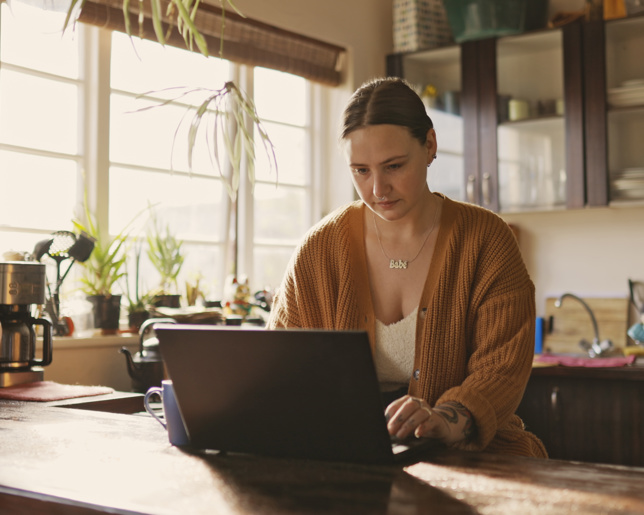 Woman working from home with coffee