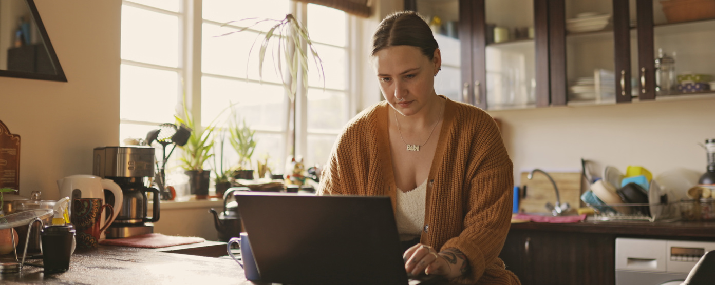 Woman working from home with coffee
